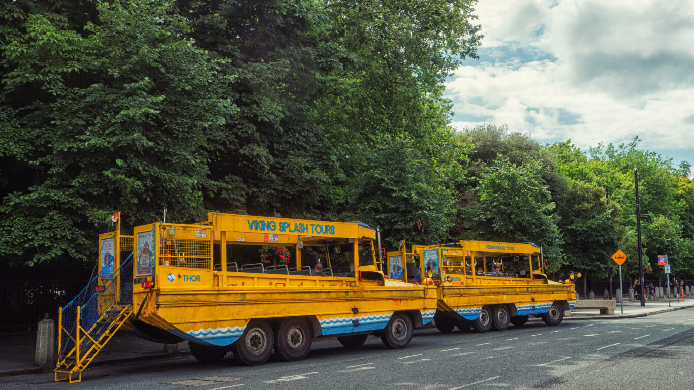 Dublin, Ireland – 07.12.2023: Famous Viking splash tours waiting for tourist by St Stephen’s Green park. Unique tour offer in Irish capital. Popular way to explore and learn city history