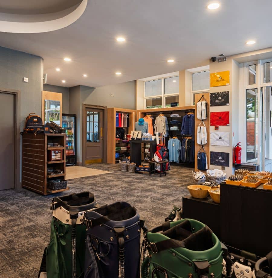 Hotel Golf Shop and Amenities Elegant hotel shop with golf gear, stylish apparel, and cosy lighting, perfect for a welcoming golf retreat experience.