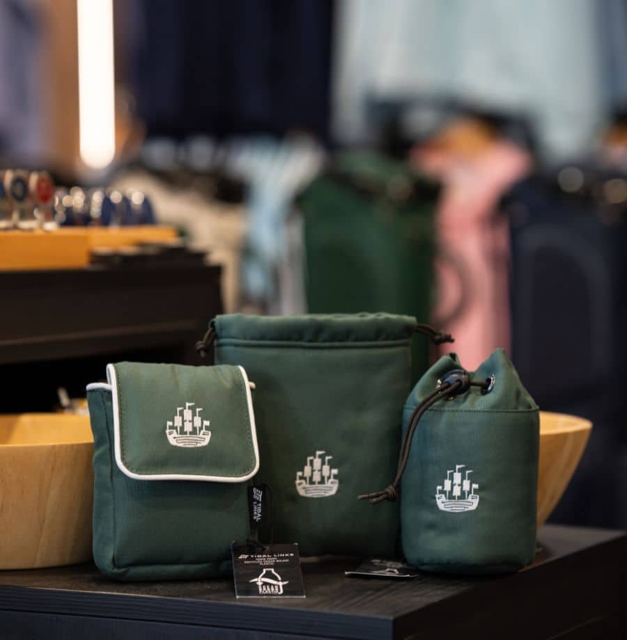 Stylish Hotel Toiletry Bags Elegant green toiletry bags with city logo in a stylish hotel room, inviting a chic and luxurious guest experience.