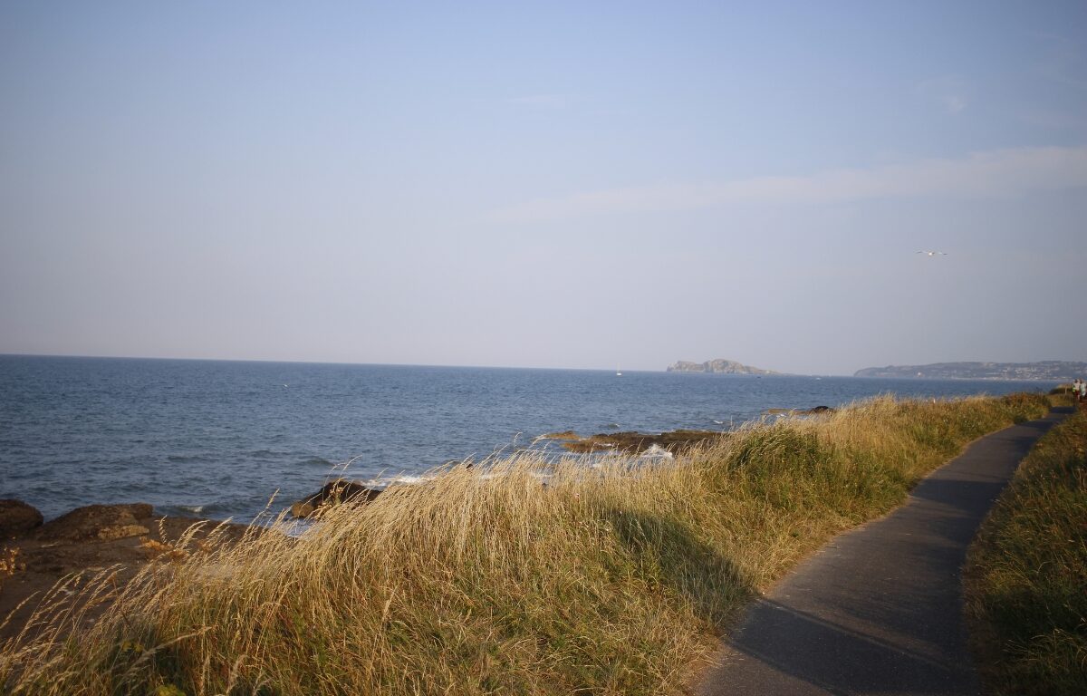 Scenic coastal path with sea views near luxury hotel, ideal for relaxing walks and beach access.